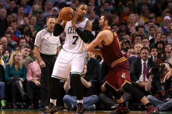 BOSTON, MA - NOVEMBER 14: Jared Sullinger #7 of the Boston Celtics controls the ball against Kevin Love #0 of the Cleveland Cavaliers at TD Garden on November 14, 2014 in Boston, Massachusetts. NOTE TO USER: User expressly acknowledges and agrees that, by