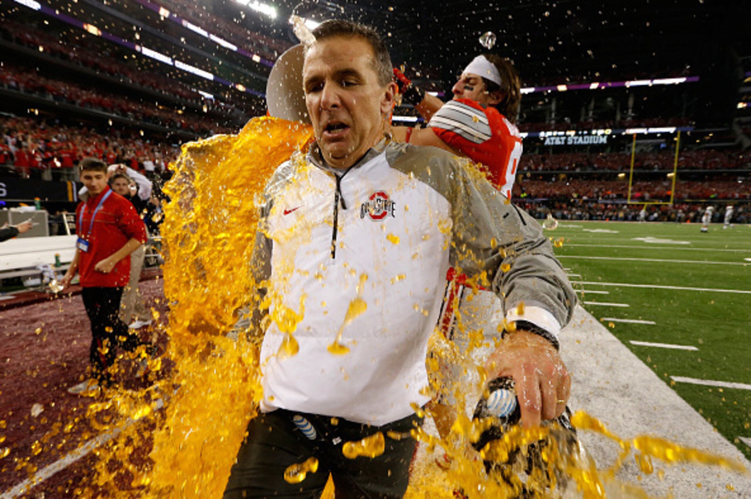 ARLINGTON, TX - JANUARY 12:  Head Coach Urban Meyer of the Ohio State Buckeyes gets dunked with Gatorade by tight end Nick Vannett #81 in the fourth quarter against the Oregon Ducks during the College Football Playoff National Championship Game at AT&T St