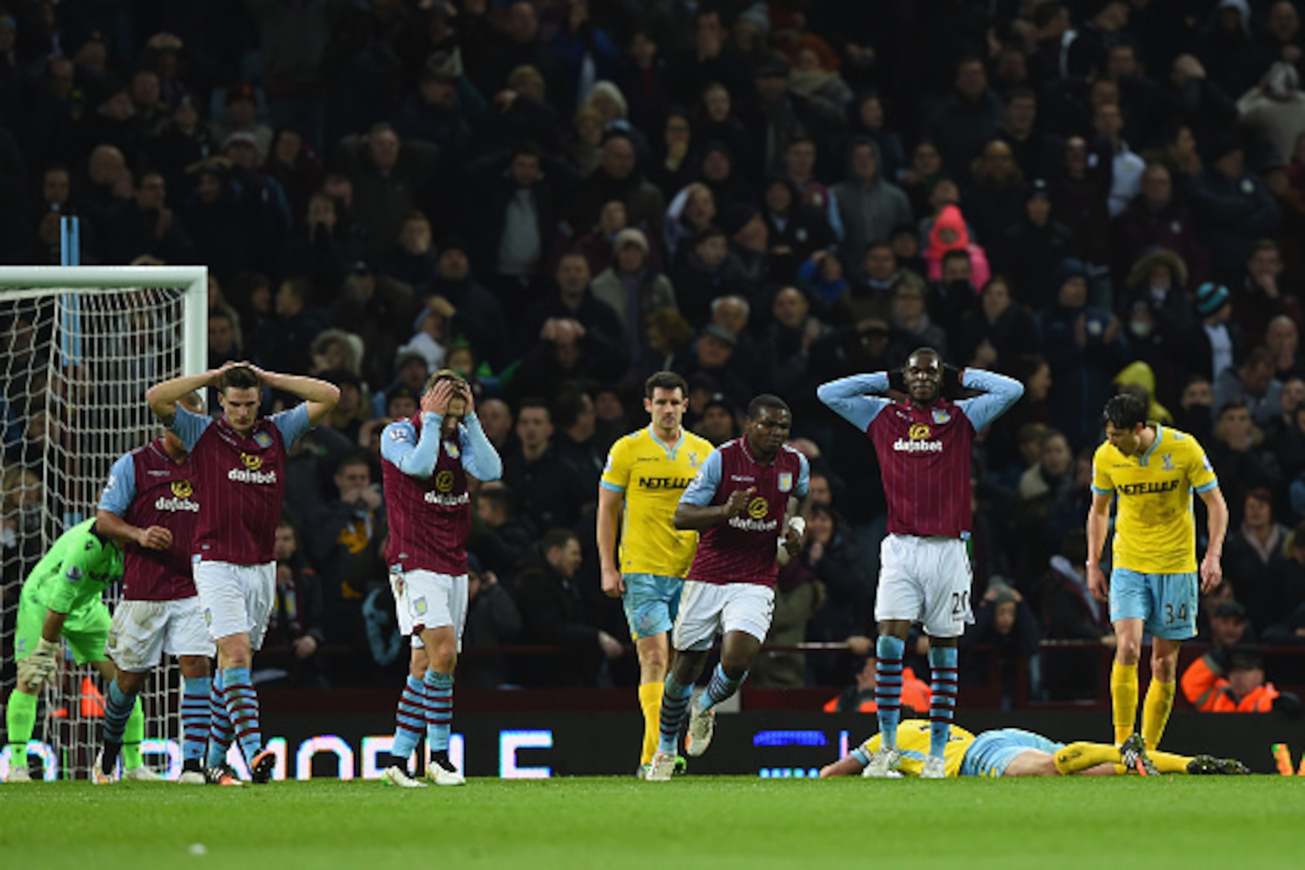 BIRMINGHAM, ENGLAND - JANUARY 01:  Aston Villa players react during the Barclays Premier League match between Aston Villa and Crystal Palace at Villa Park on January 1, 2015 in Birmingham, England.  (Photo by Shaun Botterill/Getty Images)