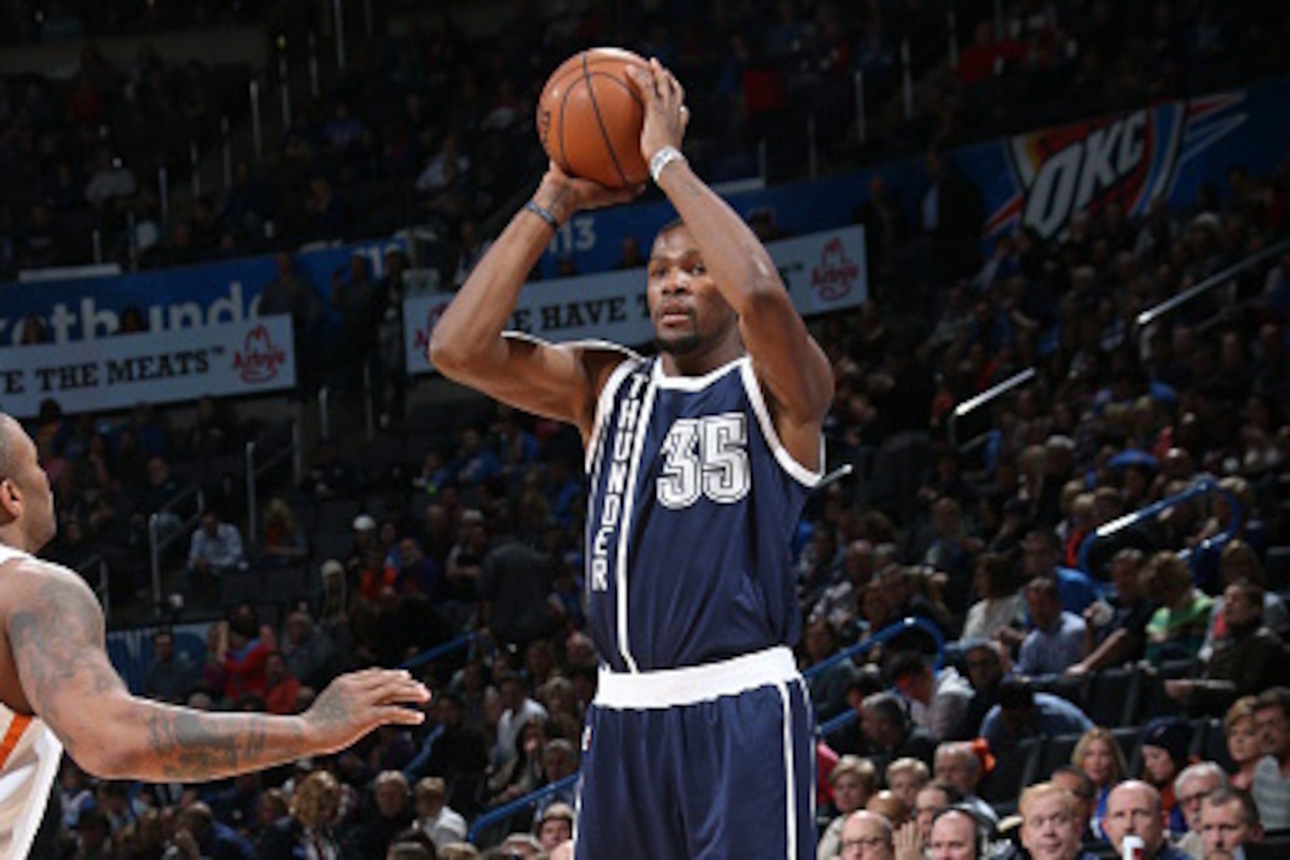 OKLAHOMA CITY, OK - DECEMBER 31:  Kevin Durant #35 of the Oklahoma City Thunder shoots against the Phoenix Suns on December 31, 2014 at the Chesapeake Energy Arena in Oklahoma City, Oklahoma. NOTE TO USER: User expressly acknowledges and agrees that, by d