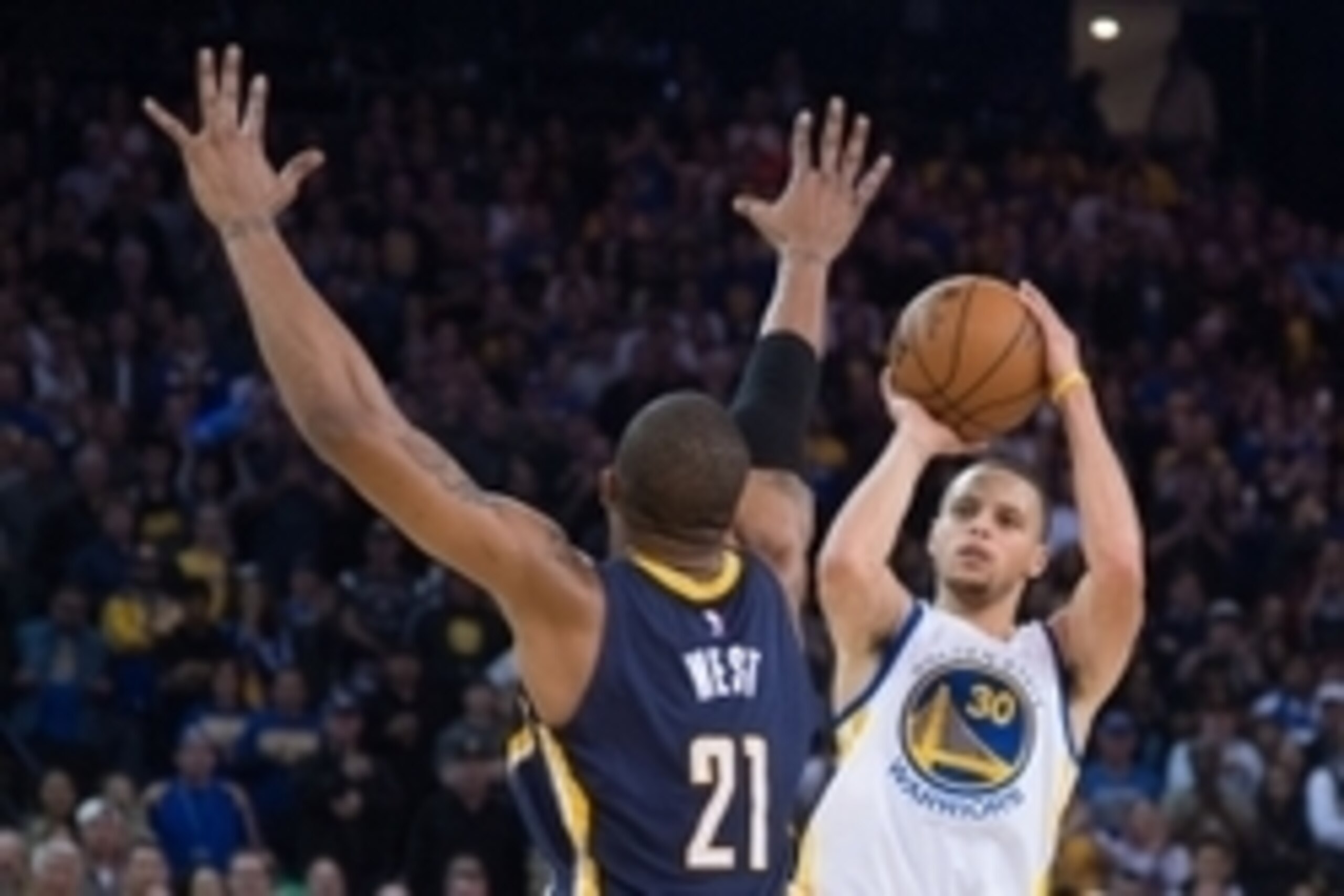 January 7, 2015; Oakland, CA, USA; Golden State Warriors guard Stephen Curry (30) shoots the basketball against Indiana Pacers forward David West (21) during the second quarter at Oracle Arena. Mandatory Credit: Kyle Terada-USA TODAY Sports