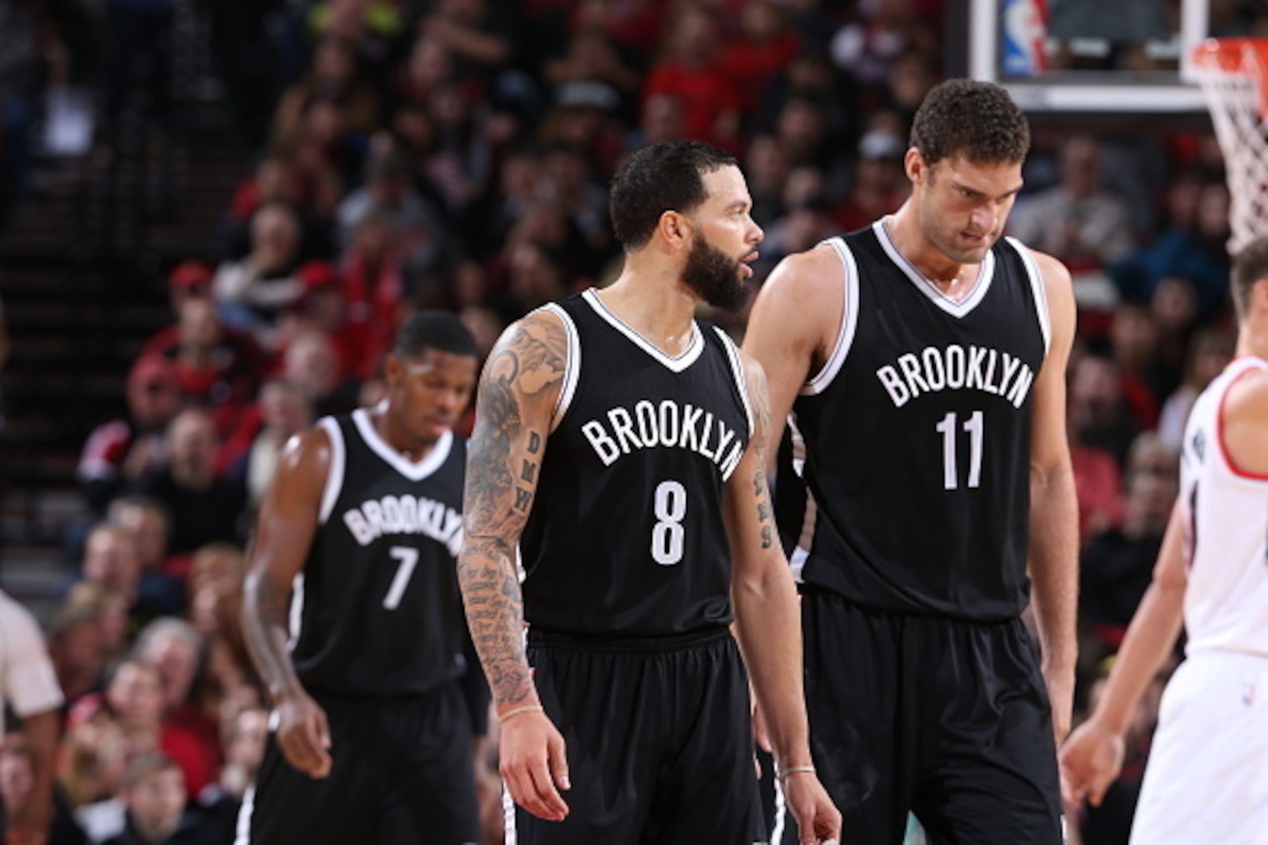 PORTLAND, OR - NOVEMBER 15: Deron Williams and Brook Lopez #11 of the Brooklyn Nets walk against the Portland Trail Blazers on November 15, 2014 at the Moda Center Arena in Portland, Oregon. NOTE TO USER: User expressly acknowledges and agrees that, by do