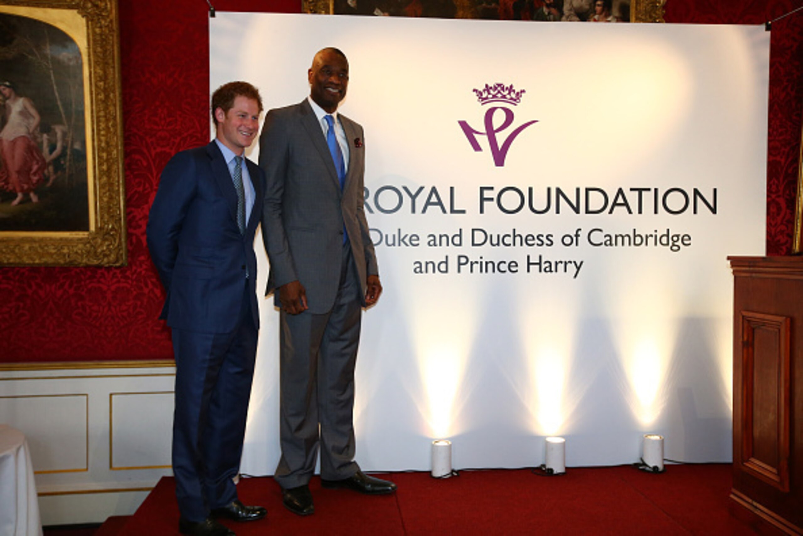 LONDON, ENGLAND - JANUARY 14:  Prince Harry and NBA Ambassador Dikembe Mutombo at the Coach Core graduation ceremony. This event is part of the partnership between the Royal Foundation and the NBA as part of the 2015 Global Games on January 14, 2015 at St