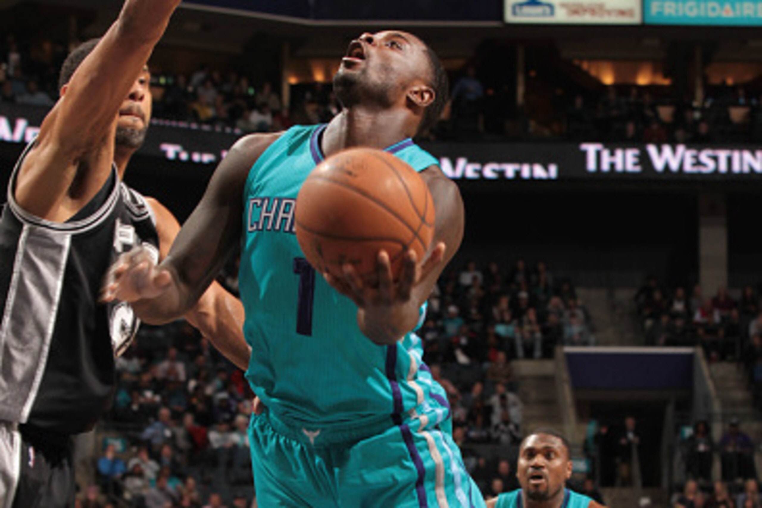 CHARLOTTE, NC - JANUARY 14: Lance Stephenson #1 of the Charlotte Hornets shoots against Tim Duncan #21 of the San Antonio Spurs during the game at the Time Warner Cable Arena on January 14, 2015 in Charlotte, North Carolina. NOTE TO USER: User expressly CHARLOTTE, NC - JANUARY 14: Lance Stephenson #1 of the Charlotte Hornets shoots against Tim Duncan #21 of the San Antonio Spurs during the game at the Time Warner Cable Arena on January 14, 2015 in Charlotte, North Carolina. NOTE TO USER: User expressly