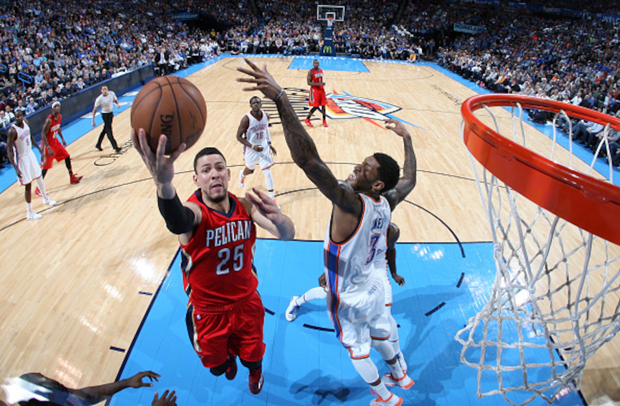 OKLAHOMA CITY, OK- DECEMBER 21:  Austin Rivers #25 of the New Orleans Pelicans goes up for a shot against the Oklahoma City Thunder on December 21, 2014 at Chesapeake Energy Arena in Oklahoma City, OK. NOTE TO USER: User expressly acknowledges and agrees 