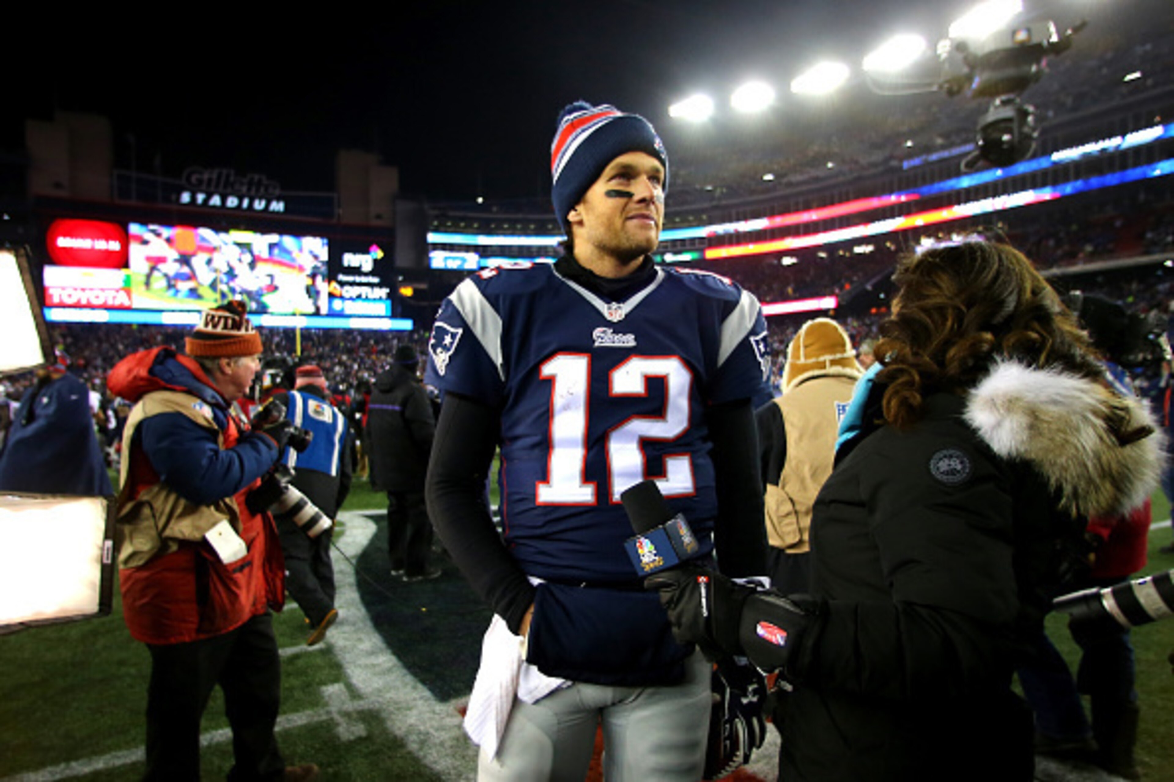 FOXBORO, MA - JANUARY 10:  Tom Brady #12 of the New England Patriots speaks to media after defeating the Baltimore Ravens during the 2015 AFC Divisional Playoffs game at Gillette Stadium on January 10, 2015 in Foxboro, Massachusetts.  (Photo by Elsa/Getty
