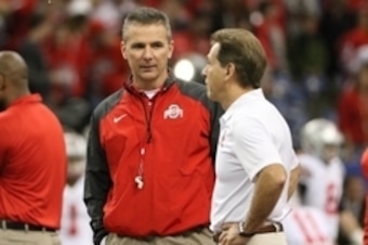 Jan 1, 2015; New Orleans, LA, USA; Alabama Crimson Tide head coach Nick Saban and Ohio State Buckeyes head coach Urban Meyer speak on the field prior to the 2015 Sugar Bowl at Mercedes-Benz Superdome. Mandatory Credit: Derick E. Hingle-USA TODAY Sports
