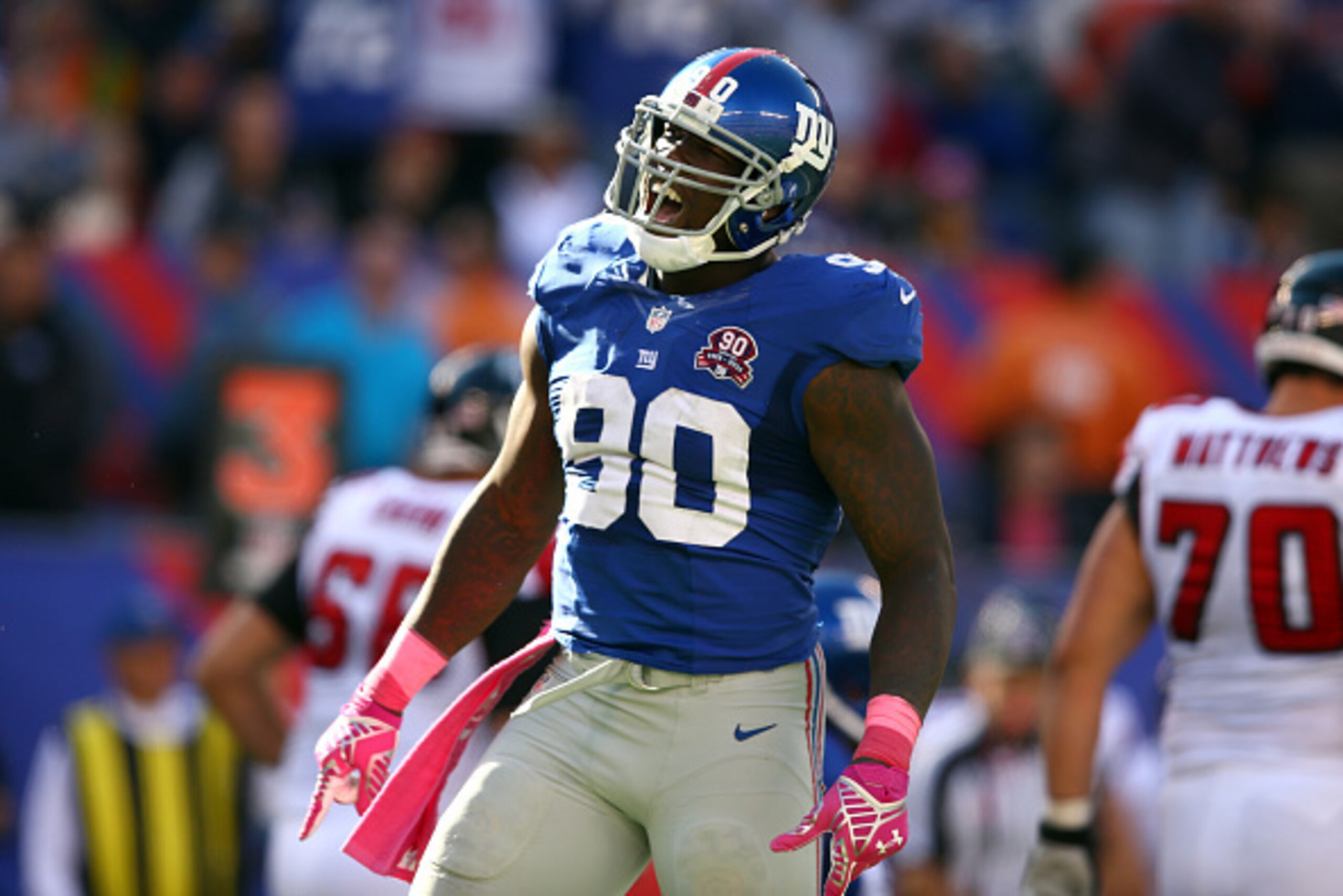 EAST RUTHERFORD, NJ - OCTOBER 05:  Defensive end Jason Pierre-Paul #90 of the New York Giants reacts after a play in the fourth quarter against the Atlanta Falcons during their game at MetLife Stadium on October 5, 2014 in East Rutherford, New Jersey.  (P