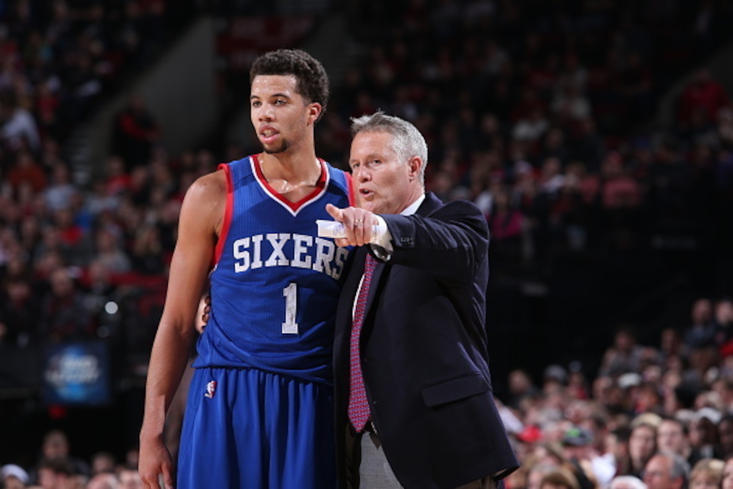 PORTLAND, OR - DECEMBER 26: Brett Brown of the Philadelphia 76ers talks with Michael Carter-Williams #1 during the game against the Portland Trail Blazers on December 26, 2014 at the Moda Center Arena in Portland, Oregon. NOTE TO USER: User expressly ack PORTLAND, OR - DECEMBER 26: Brett Brown of the Philadelphia 76ers talks with Michael Carter-Williams #1 during the game against the Portland Trail Blazers on December 26, 2014 at the Moda Center Arena in Portland, Oregon. NOTE TO USER: User expressly ack