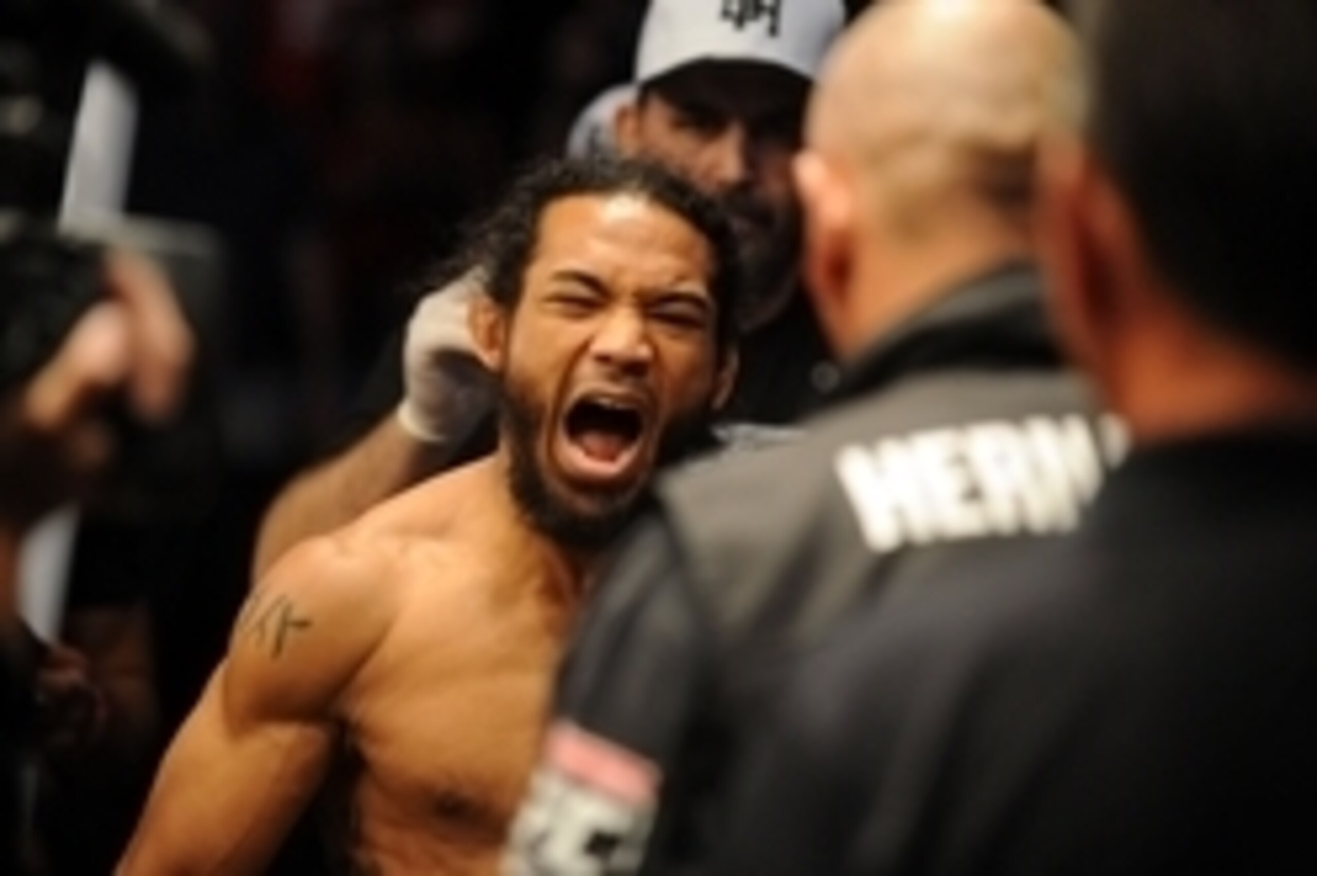 Aug 23, 2014; Tulsa, OK, USA; Benson Henderson (red gloves) enters the arena before fighting Rafael Dos Anjos (blue gloves) in the Main Event, Lightweight Bout at BOK Center. Mandatory Credit: Mark D. Smith-USA TODAY Sports