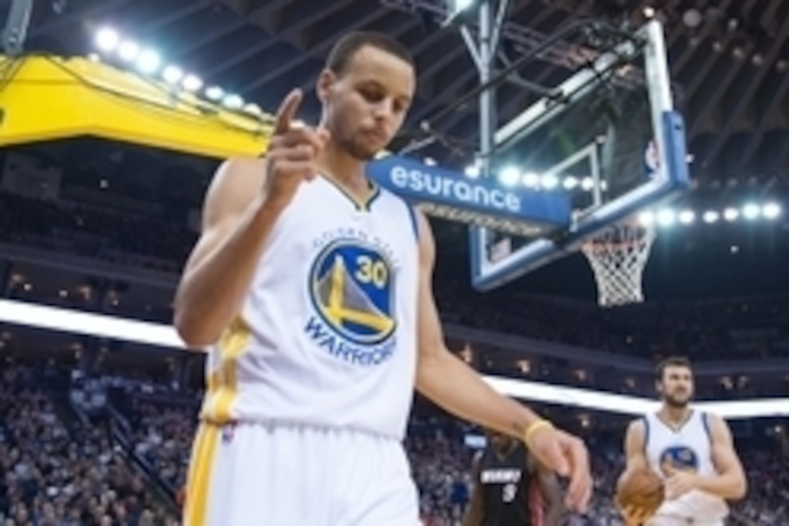 January 14, 2015; Oakland, CA, USA; Golden State Warriors guard Stephen Curry (30) celebrates after a basket against the Miami Heat during the third quarter at Oracle Arena. The Warriors defeated the Heat 104-89. Mandatory Credit: Kyle Terada-USA TODAY Sp January 14, 2015; Oakland, CA, USA; Golden State Warriors guard Stephen Curry (30) celebrates after a basket against the Miami Heat during the third quarter at Oracle Arena. The Warriors defeated the Heat 104-89. Mandatory Credit: Kyle Terada-USA TODAY Sp
