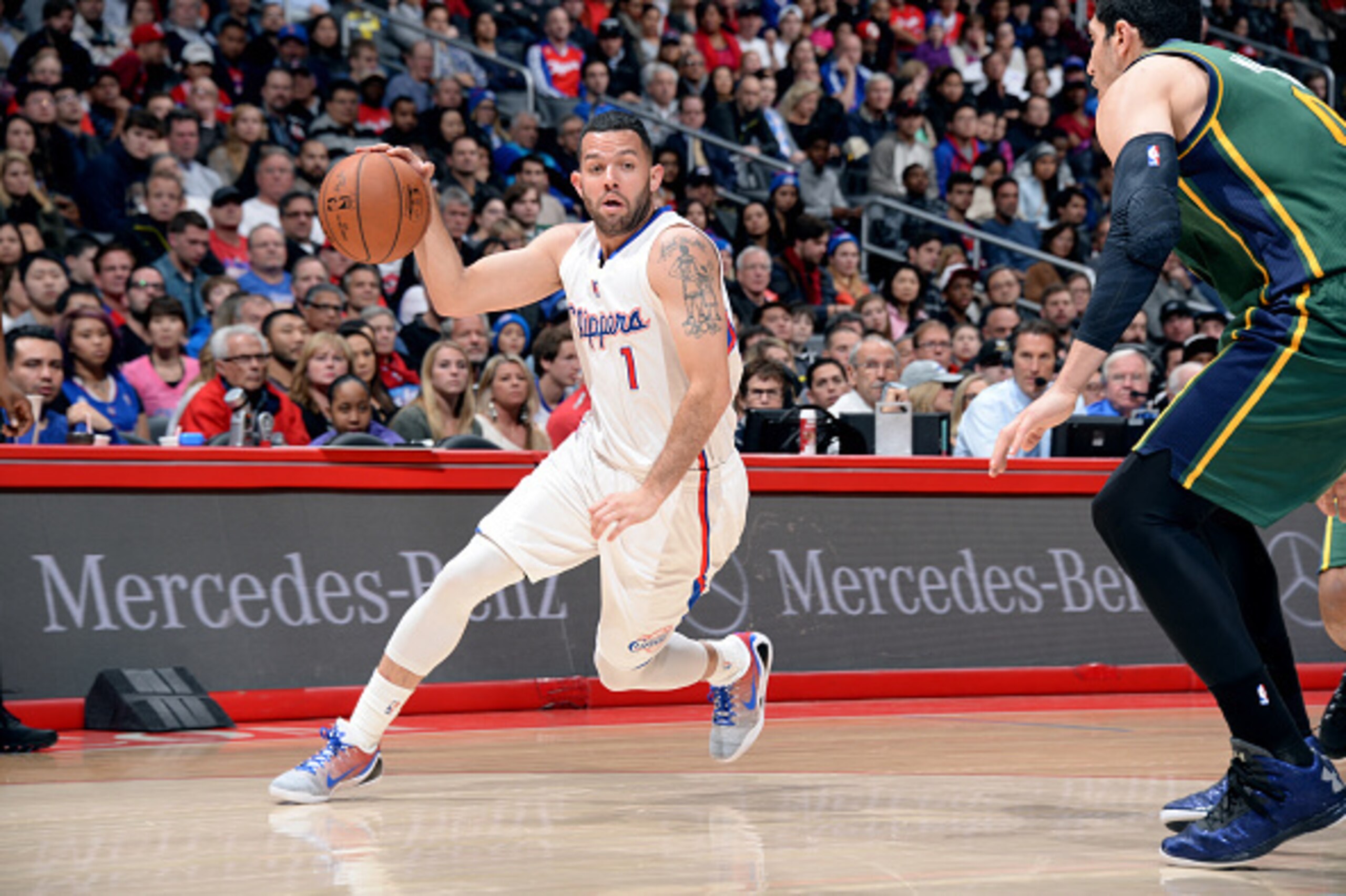 LOS ANGELES, CA - DECEMBER 29: Jordan Farmar #1 of the Los Angeles Clippers drives against the Utah Jazz on December 29, 2014 at STAPLES Center in Los Angeles, California. NOTE TO USER: User expressly acknowledges and agrees that, by downloading and/or us