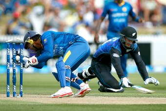 HAMILTON, NEW ZEALAND - JANUARY 15: Kumar Sangakkara of Sri Lanka runs out Daniel Vettori of New Zealand during the One Day International match between New Zealand and Sri Lanka at Seddon Park on January 15, 2015 in Hamilton, New Zealand.  (Photo by Phil 