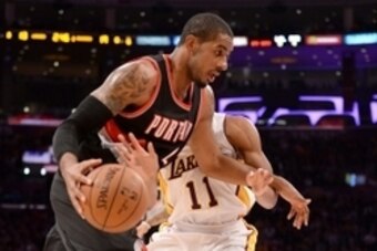 Jan 11, 2015; Los Angeles, CA, USA;  Los Angeles Lakers forward Wesley Johnson (11) guards Portland Trail Blazers forward LaMarcus Aldridge (12) in the first half of the game at Staples Center. Mandatory Credit: Jayne Kamin-Oncea-USA TODAY Sports