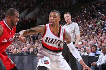PORTLAND, OR - JANUARY 14:  Damian Lillard #0 of the Portland Trail Blazers handles the ball against the Los Angeles Clippers during the game on January 14, 2015 at the Moda Center in Portland, Oregon. NOTE TO USER: User expressly acknowledges and agrees 