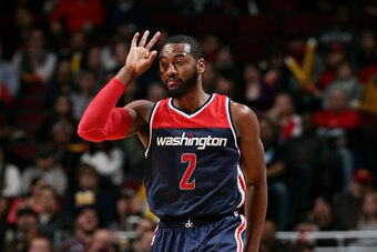 CHICAGO, IL - JANUARY 14: John Wall #2 of the Washington Wizards celebrates during a game against the Chicago Bulls on January 14, 2015 at the United Center in Chicago, Illinois. NOTE TO USER: User expressly acknowledges and agrees that, by downloading an