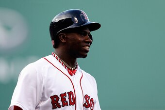 BOSTON, MA - SEPTEMBER 28:  Rusney Castillo #38 of the Boston Red Sox looks on against the New York Yankees during the last game of the season at Fenway Park on September 28, 2014 in Boston, Massachusetts.  (Photo by Jim Rogash/Getty Images)
