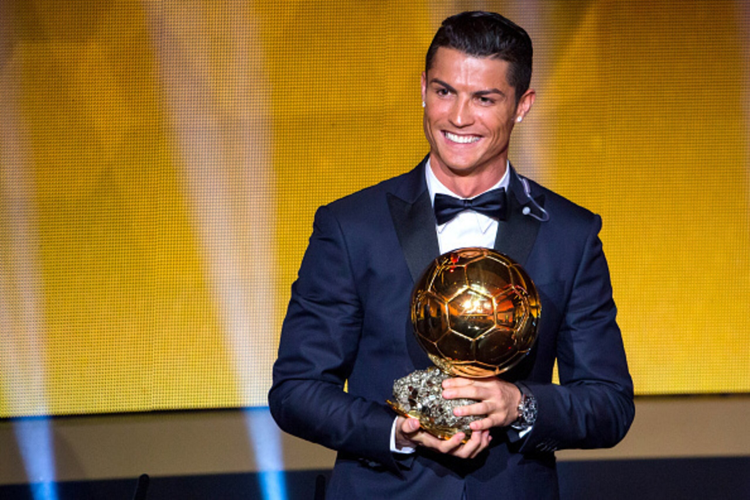 ZURICH, SWITZERLAND - JANUARY 12: Cristiano Ronaldo of Portugal and Real Madrid receives the 2014 FIFA Ballon d'Or award for the player of the year during the FIFA Ballon d'Or Gala 2014 at the Kongresshaus on January 12, 2015 in Zurich, Switzerland. (Phot
