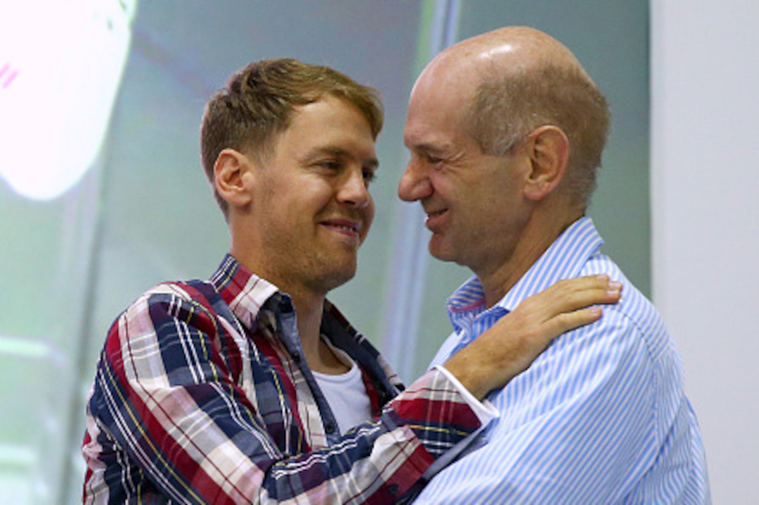 MILTON KEYNES, ENGLAND - DECEMBER 02: Sebastian Vettel of Germany hugs Adrian Newey, the Chief Technical Officer of Infiniti Red Bull Racing during a visit to the Red Bull Racing Factory on December 2, 2014 in Milton Keynes, England. (Photo by Dan Istit MILTON KEYNES, ENGLAND - DECEMBER 02: Sebastian Vettel of Germany hugs Adrian Newey, the Chief Technical Officer of Infiniti Red Bull Racing during a visit to the Red Bull Racing Factory on December 2, 2014 in Milton Keynes, England. (Photo by Dan Istit