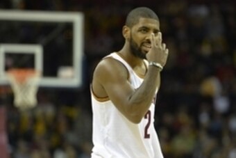 Dec 9, 2014; Cleveland, OH, USA; Cleveland Cavaliers guard Kyrie Irving (2) reacts in the third quarter against the Toronto Raptors at Quicken Loans Arena. Mandatory Credit: David Richard-USA TODAY Sports