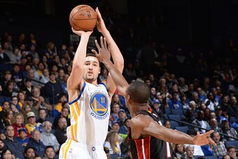 OAKLAND, CA - JANUARY 14:  Klay Thompson #11 of the Golden State Warriors takes a shot against the Miami Heat on January 14, 2015 at Oracle Arena in Oakland, California. NOTE TO USER: User expressly acknowledges and agrees that, by downloading and or usin
