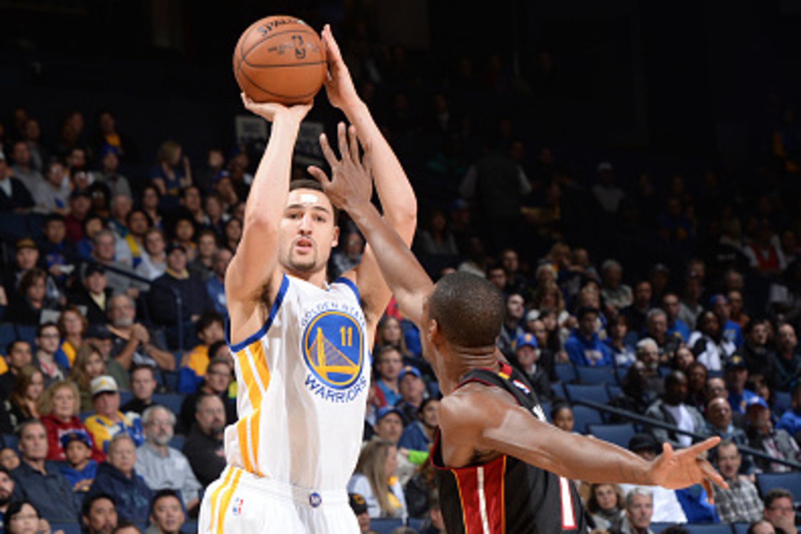 OAKLAND, CA - JANUARY 14:  Klay Thompson #11 of the Golden State Warriors takes a shot against the Miami Heat on January 14, 2015 at Oracle Arena in Oakland, California. NOTE TO USER: User expressly acknowledges and agrees that, by downloading and or usin
