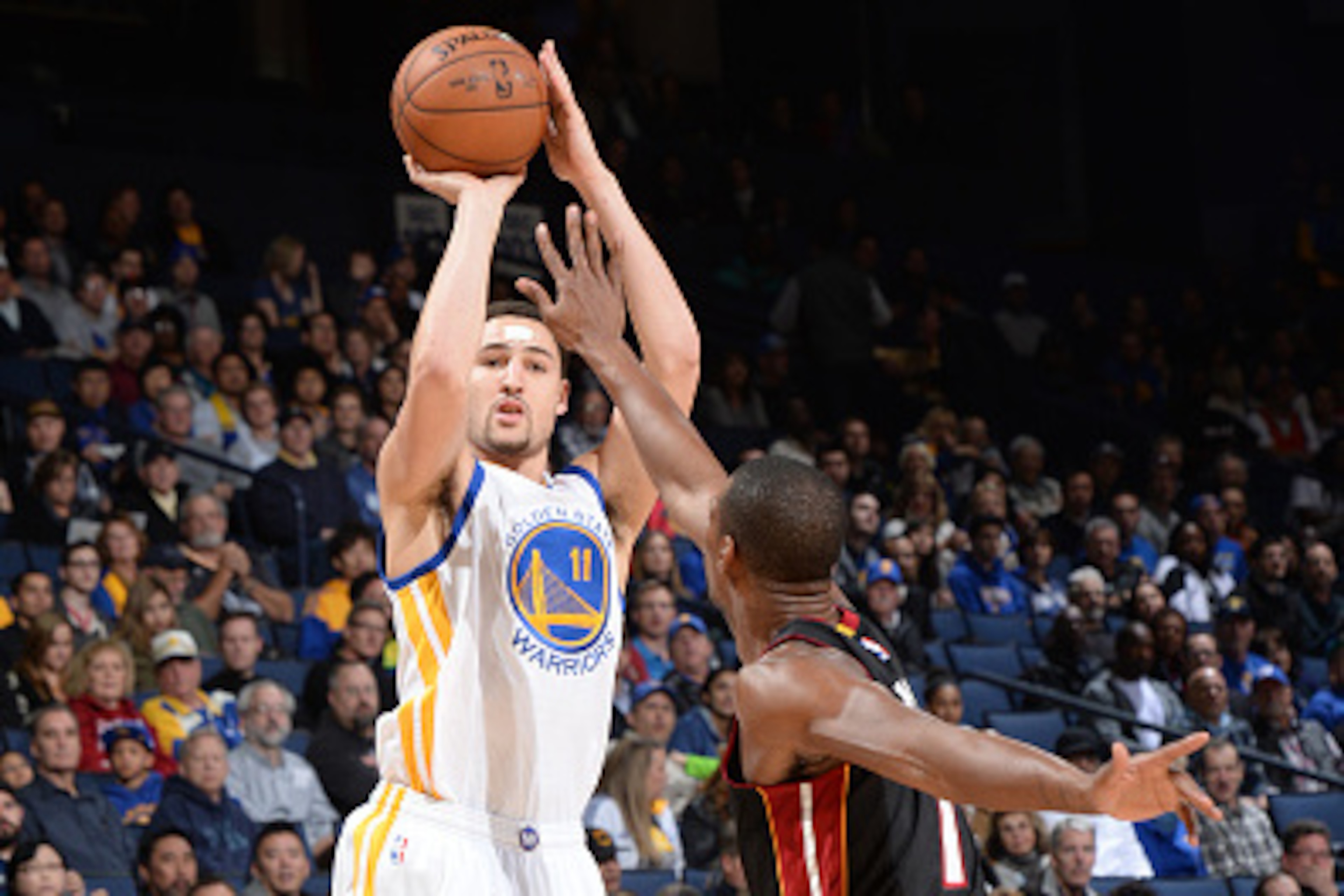 OAKLAND, CA - JANUARY 14:  Klay Thompson #11 of the Golden State Warriors takes a shot against the Miami Heat on January 14, 2015 at Oracle Arena in Oakland, California. NOTE TO USER: User expressly acknowledges and agrees that, by downloading and or usin
