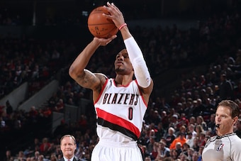 PORTLAND, OR - JANUARY 3:  Damian Lillard #0 of the Portland Trail Blazers takes a shot against the Atlanta Hawks on January 3, 2015 at the Moda Center Arena in Portland, Oregon. NOTE TO USER: User expressly acknowledges and agrees that, by downloading an