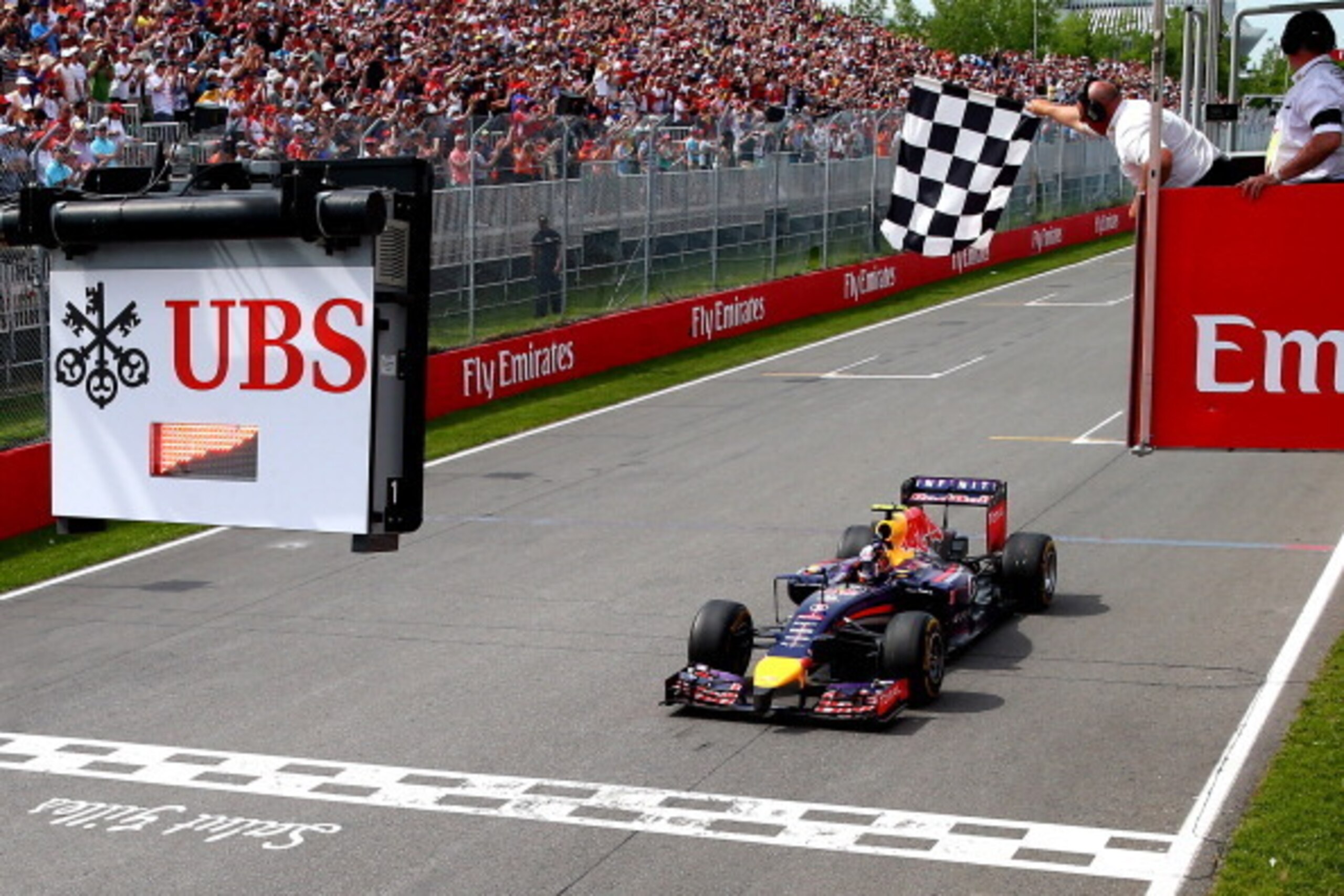 MONTREAL, QC - JUNE 08: Daniel Ricciardo of Australia and Infiniti Red Bull Racing crosses the finish line to take his first Grand Prix victory during the Canadian Formula One Grand Prix at Circuit Gilles Villeneuve on June 8, 2014 in Montreal, Canada. MONTREAL, QC - JUNE 08: Daniel Ricciardo of Australia and Infiniti Red Bull Racing crosses the finish line to take his first Grand Prix victory during the Canadian Formula One Grand Prix at Circuit Gilles Villeneuve on June 8, 2014 in Montreal, Canada.