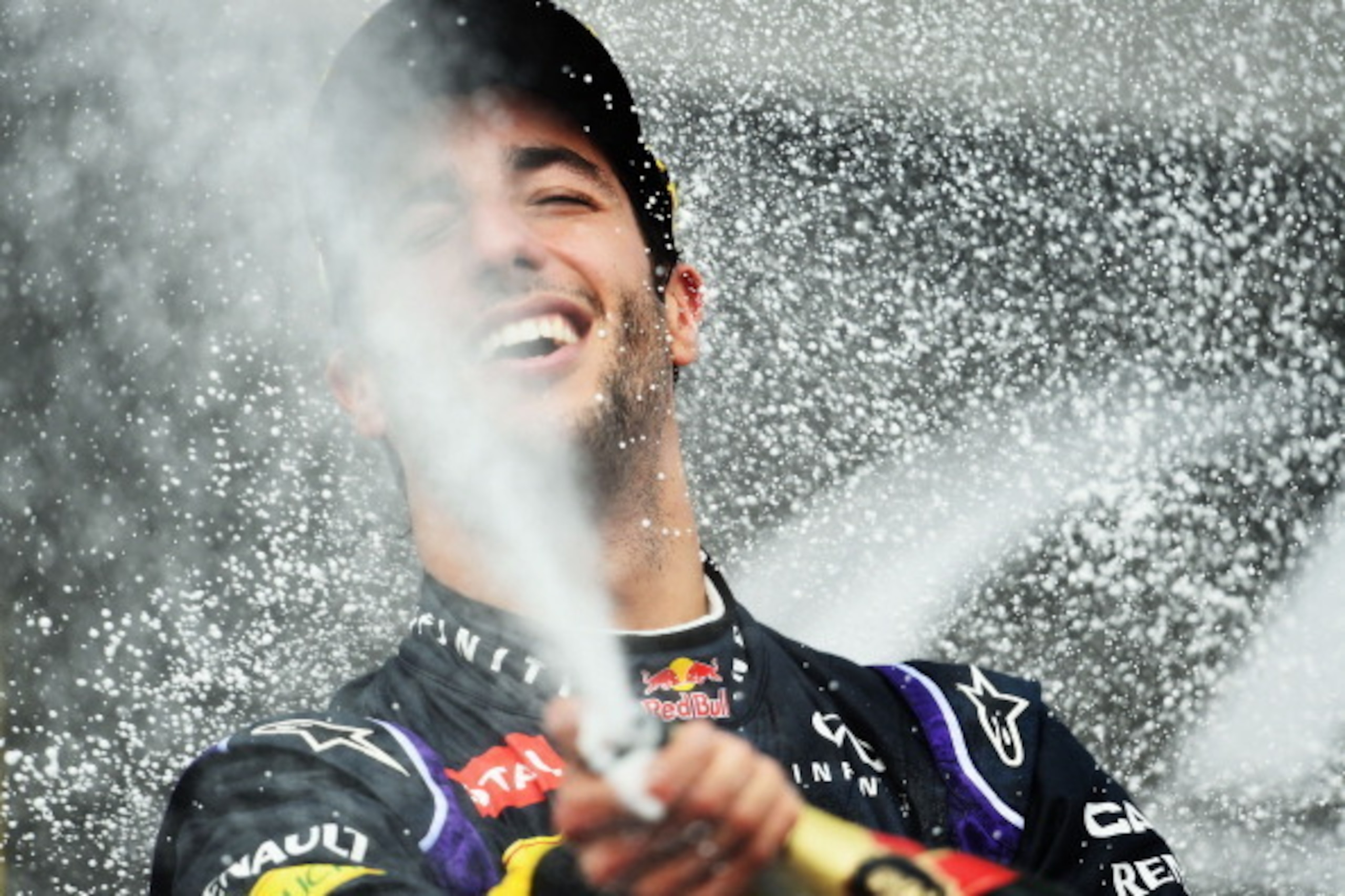 BUDAPEST, HUNGARY - JULY 27: Daniel Ricciardo of Australia and Infiniti Red Bull Racing celebrates victory on the podium after the Hungarian Formula One Grand Prix at Hungaroring on July 27, 2014 in Budapest, Hungary. (Photo by Lars Baron/Getty Images) BUDAPEST, HUNGARY - JULY 27: Daniel Ricciardo of Australia and Infiniti Red Bull Racing celebrates victory on the podium after the Hungarian Formula One Grand Prix at Hungaroring on July 27, 2014 in Budapest, Hungary. (Photo by Lars Baron/Getty Images)