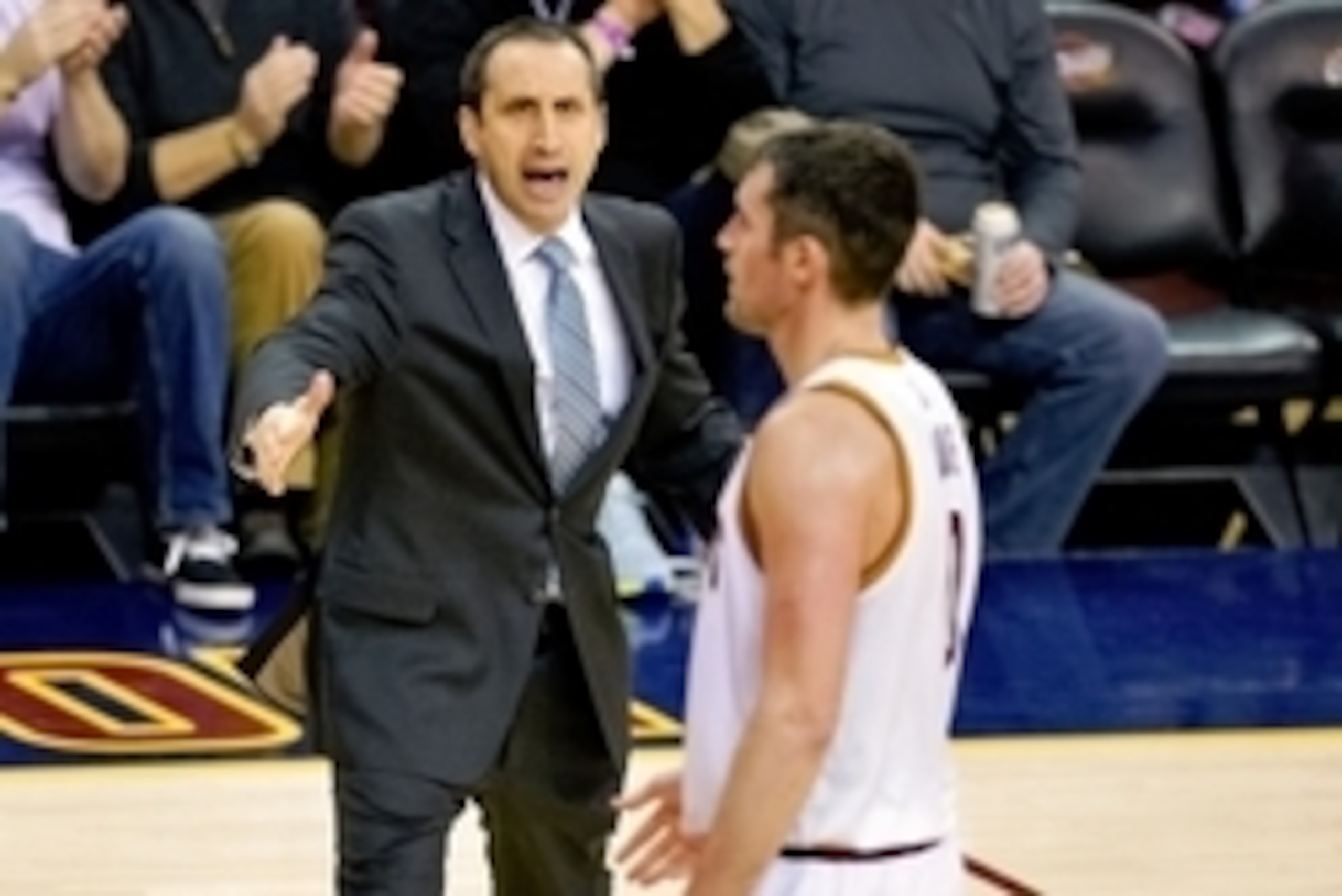 Jan 4, 2015; Cleveland, OH, USA; Cleveland Cavaliers head coach David Blatt reacts with forward Kevin Love (0) in the fourth quarter agains the Dallas Mavericks at Quicken Loans Arena. Mandatory Credit: David Richard-USA TODAY Sports