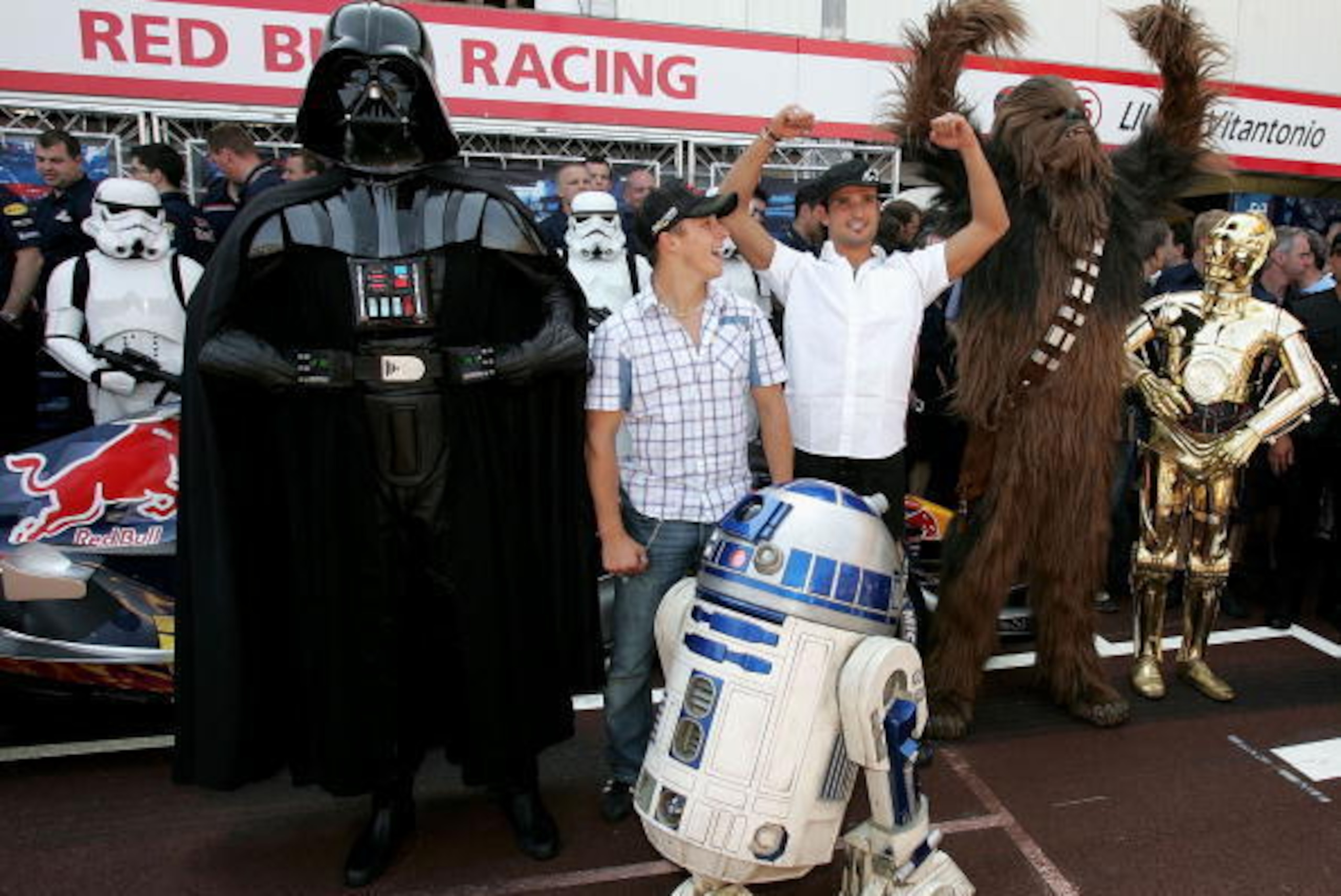MONTE CARLO, MONACO - MAY 20: Christian Klien of Austria and Red Bull (2nd-L) and Vitantonio Liuzzi of Italy and Red Bull (3rd-R) pose with Chewbacca, Darth Vader (L), R2D2 (front), and C3PO (R) of Star Wars outside the Red Bull Racing team garage during MONTE CARLO, MONACO - MAY 20: Christian Klien of Austria and Red Bull (2nd-L) and Vitantonio Liuzzi of Italy and Red Bull (3rd-R) pose with Chewbacca, Darth Vader (L), R2D2 (front), and C3PO (R) of Star Wars outside the Red Bull Racing team garage during