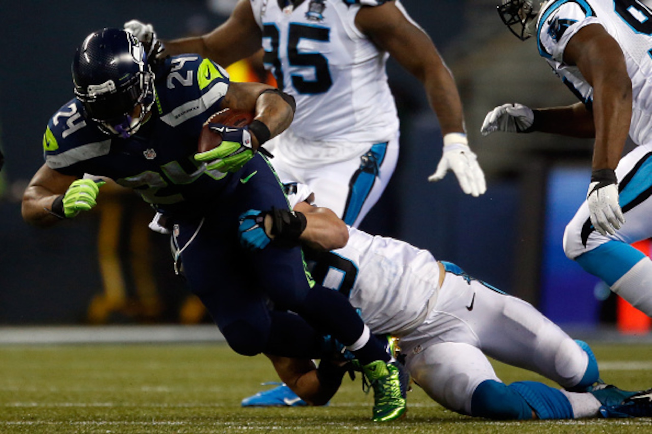 SEATTLE, WA - JANUARY 10:  Marshawn Lynch #24 of the Seattle Seahawks runs the ball against the Carolina Panthers during the 2015 NFC Divisional Playoff game at CenturyLink Field on January 10, 2015 in Seattle, Washington.  (Photo by Otto Greule Jr/Getty 