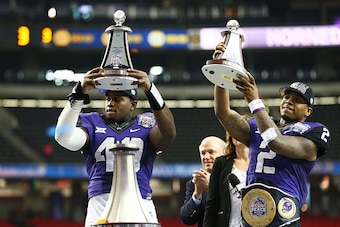 ATLANTA, GA - DECEMBER 31:  Trevone Boykin #2 and James McFarland #40 of the TCU Horned Frogs celebrate after their 42 to 3 win over the Ole Miss Rebels during the Chik-fil-A Peach Bowl at Georgia Dome on December 31, 2014 in Atlanta, Georgia.  (Photo by 