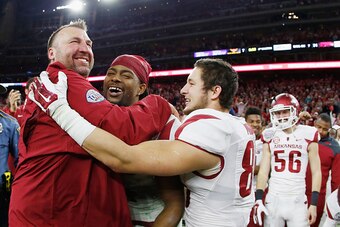 HOUSTON, TX - DECEMBER 29:  Head coach Bret Bielema of the Arkansas Razorbacks celebrates with his players after the Razorbacks defeated the Texas Longhorns 31-7 at the AdvoCare V100 Texas Bowl at NRG Stadium on December 29, 2014 in Houston, Texas.  (Phot