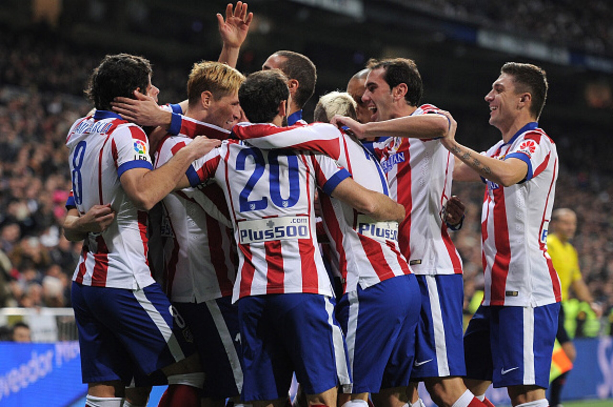 MADRID, SPAIN - JANUARY 15: Fernando Torres of Atletico de Madrid celebrates with team mates after scoring Atletico's opening goal during the Copa del Rey Round of 16, Second leg match between Real Madrid and Atletico de Madrid at Estadio Santiago Bernab MADRID, SPAIN - JANUARY 15: Fernando Torres of Atletico de Madrid celebrates with team mates after scoring Atletico's opening goal during the Copa del Rey Round of 16, Second leg match between Real Madrid and Atletico de Madrid at Estadio Santiago Bernab