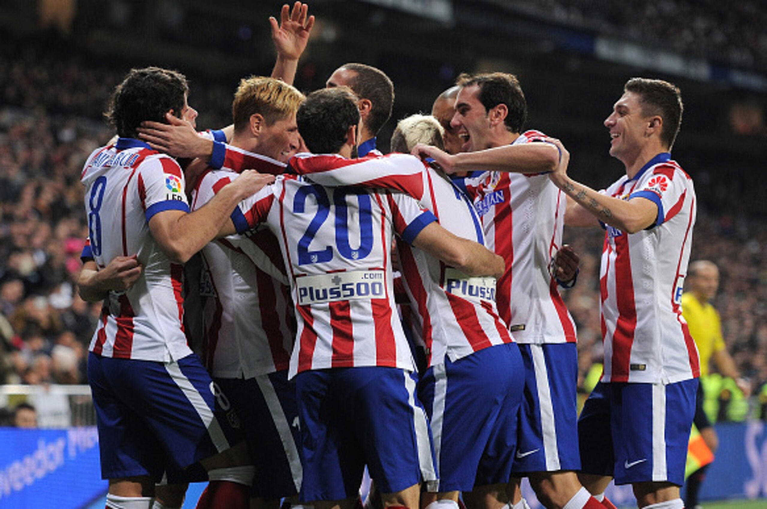 MADRID, SPAIN - JANUARY 15: Fernando Torres of Atletico de Madrid celebrates with team mates after scoring Atletico's opening goal during the Copa del Rey Round of 16, Second leg match between Real Madrid and Atletico de Madrid at Estadio Santiago Bernab MADRID, SPAIN - JANUARY 15: Fernando Torres of Atletico de Madrid celebrates with team mates after scoring Atletico's opening goal during the Copa del Rey Round of 16, Second leg match between Real Madrid and Atletico de Madrid at Estadio Santiago Bernab