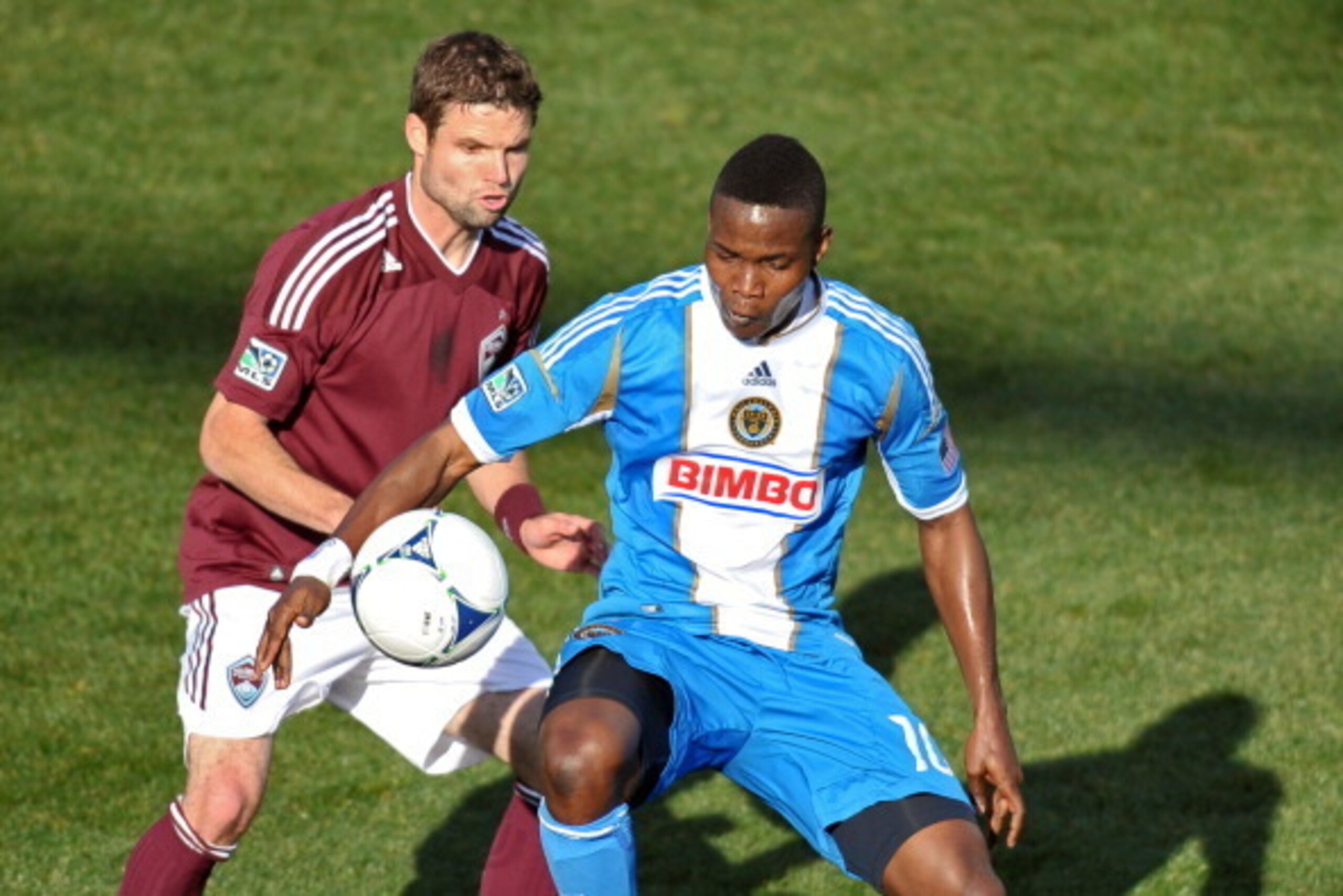 CHESTER, PA - MARCH 18: Danny Mwanga #10 of the Philadelphia Union and Drew Moor #3 of the Colorado Rapids fight for the ball at PPL Park on March 18, 2012 in Chester, Pennsylvania. (Photo by Drew Hallowell/Getty Images)