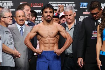 MACAU - NOVEMBER 22:  Manny Pacquiao steps on the scales during the official weigh in at The Venetian on November 22, 2014 in Macau. Pacquiao will defend his WBO world welterweight title against Chris Algieri in Macau.  (Photo by Chris Hyde/Getty Images)