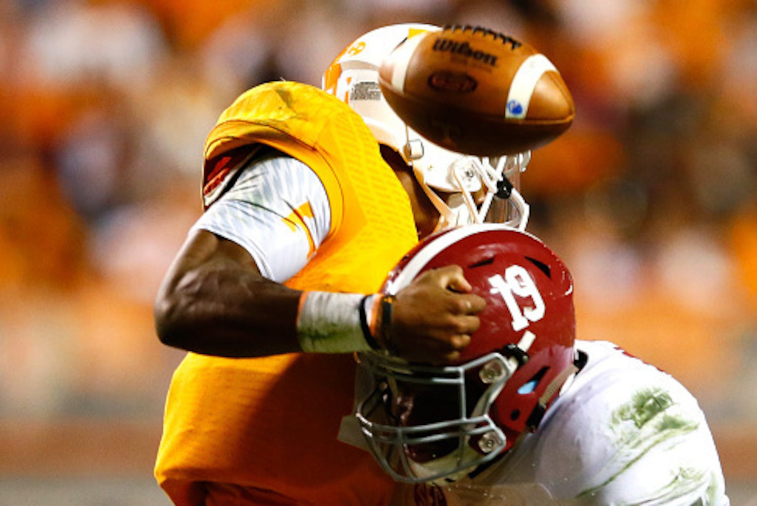 KNOXVILLE, TN - OCTOBER 25:  Reggie Ragland #19 of the Alabama Crimson Tide forces a fumble by Joshua Dobbs #11 of the Tennessee Volunteers at Neyland Stadium on October 25, 2014 in Knoxville, Tennessee.  (Photo by Kevin C. Cox/Getty Images)