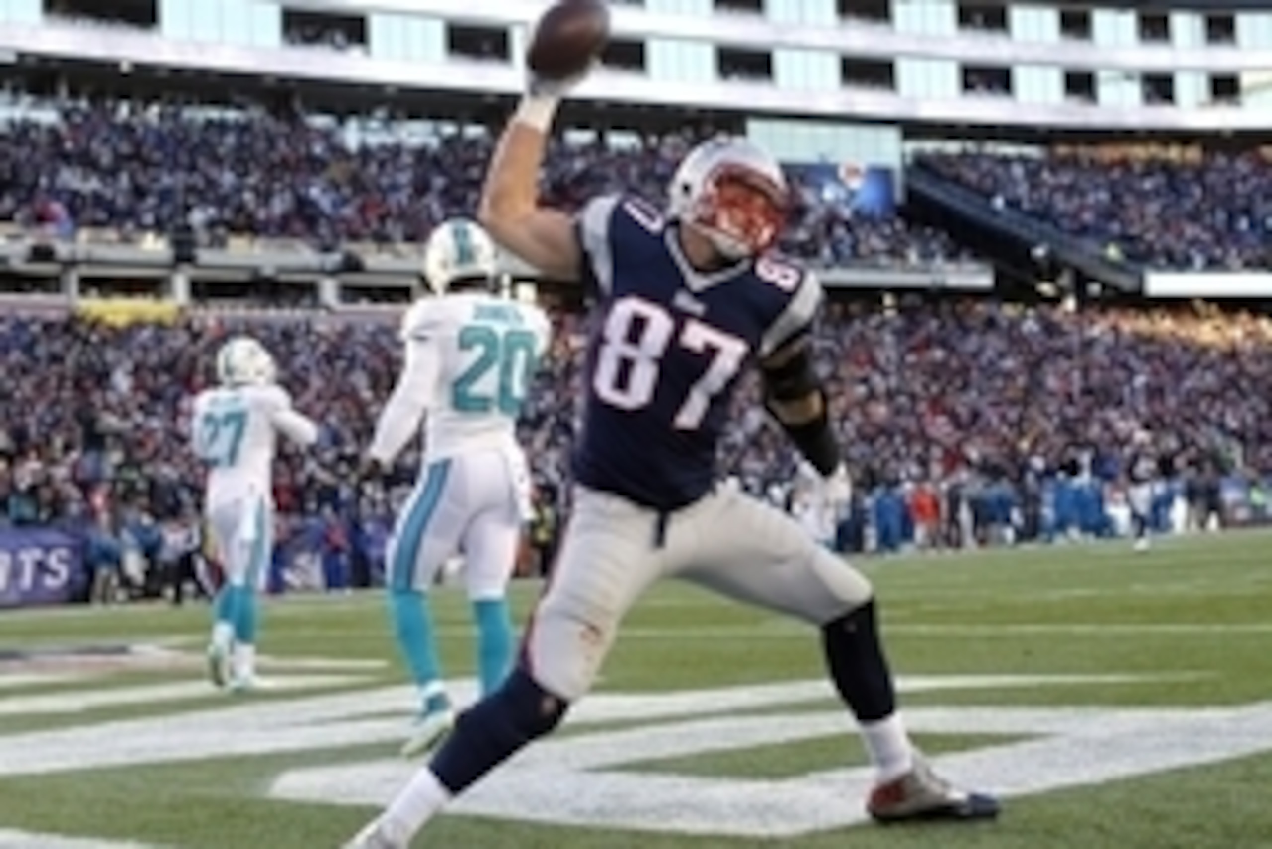 Dec 14, 2014; Foxborough, MA, USA; New England Patriots tight end Rob Gronkowski (87) celebrates after scoring a touchdown during the second half against the Miami Dolphins at Gillette Stadium. The Patriots won 41-13. Mandatory Credit: Winslow Townson-USA