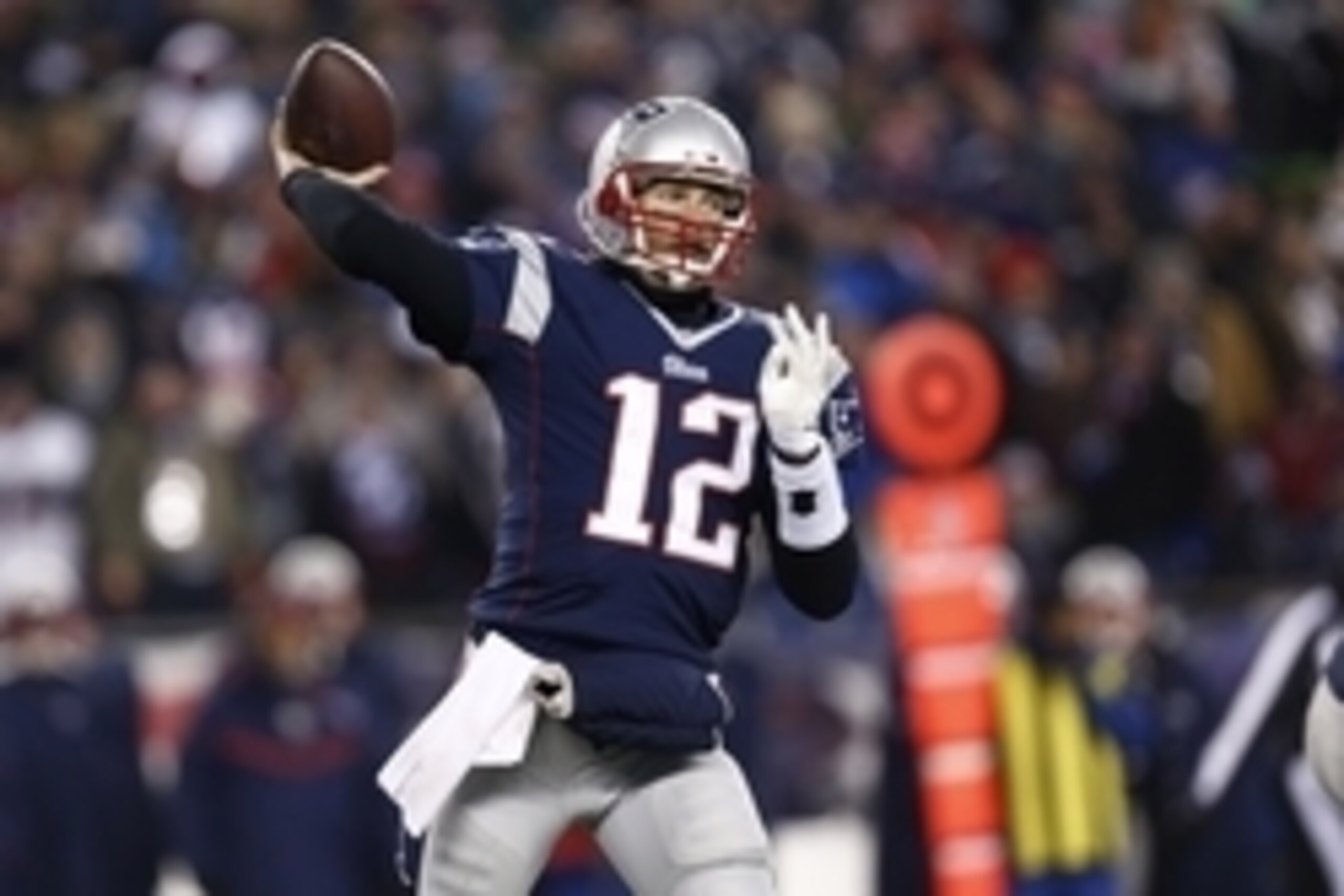 Jan 10, 2015; Foxborough, MA, USA; New England Patriots quarterback Tom Brady (12) throws the ball during the third quarter against the Baltimore Ravens in the 2014 AFC Divisional playoff football game at Gillette Stadium. Mandatory Credit: Mark L. Baer-U