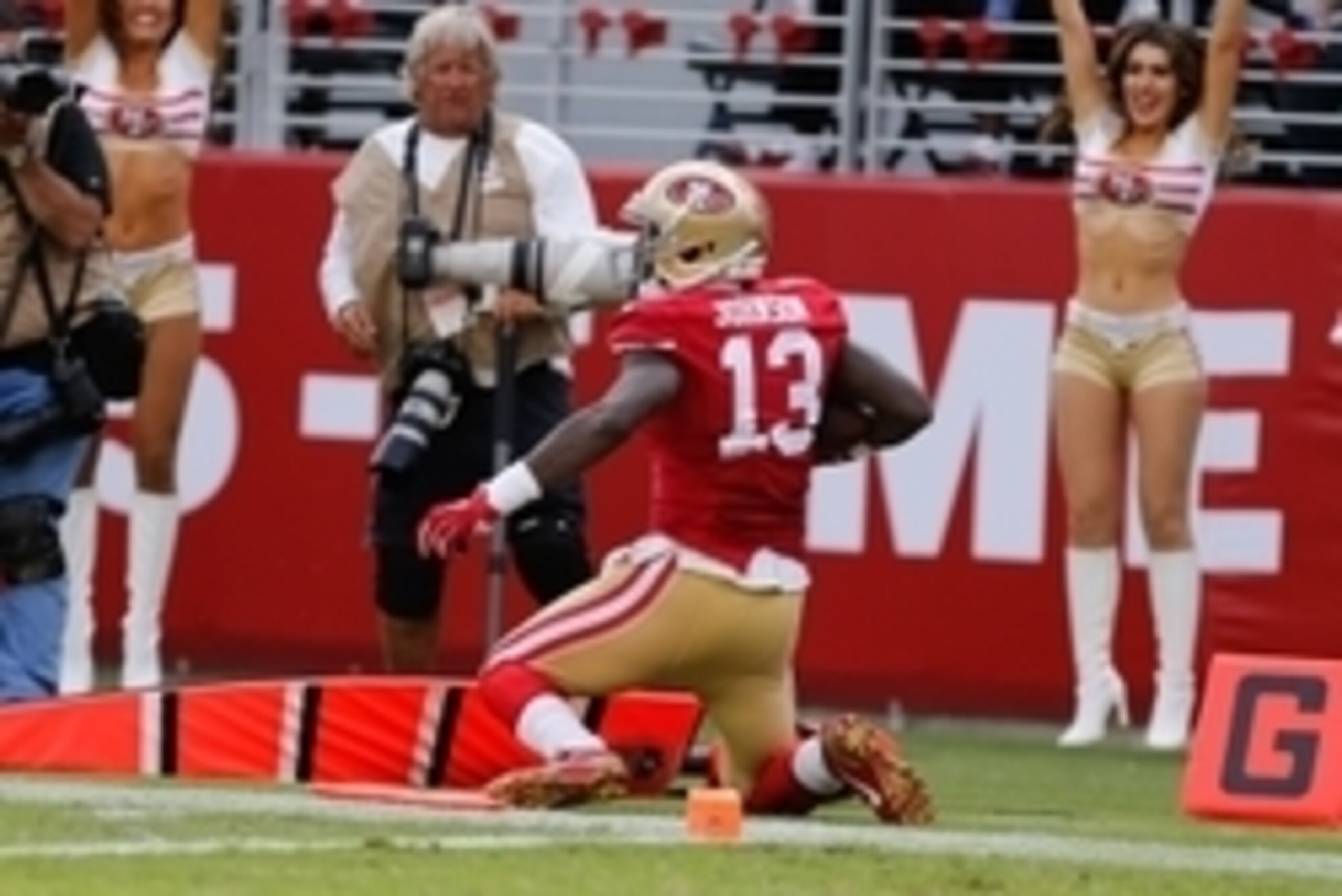 Sep 28, 2014; Santa Clara, CA, USA; San Francisco 49ers wide receiver Stevie Johnson (13) scores a touchdown against the Philadelphia Eagles during the third quarter at Levi's Stadium. The San Francisco 49ers defeated the Philadelphia Eagles 26-21. Mandat