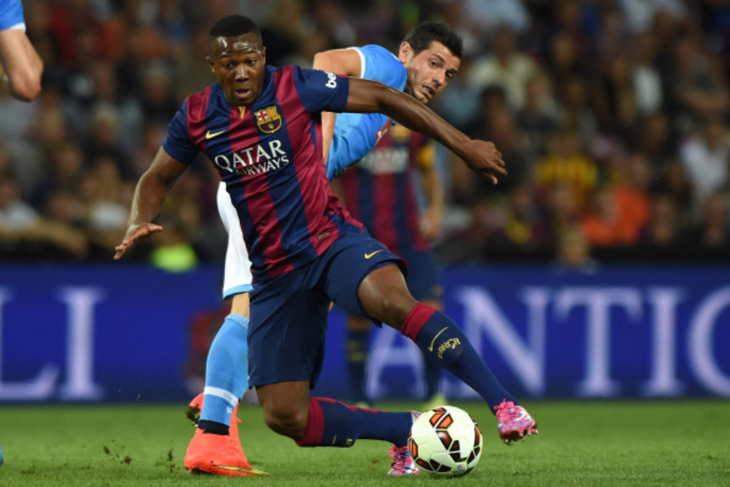 GENEVA, SWITZERLAND - AUGUST 06:  Adama Traore (L) of FC Barcelona is challenged by Blerim Dzemaili of SSC Napoli during the pre-season friendly match between FC Barcelona and SSC Napoli on August 6, 2014 in Geneva, Switzerland.  (Photo by Valerio Pennici