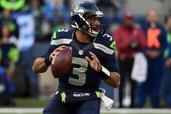 SEATTLE, WA - NOVEMBER 23:  Russell Wilson #3 of the Seattle Seahawks throws a pass against the Arizona Cardinals during their game at CenturyLink Field on November 23, 2014 in Seattle, Washington.  (Photo by Steve Dykes/Getty Images)
