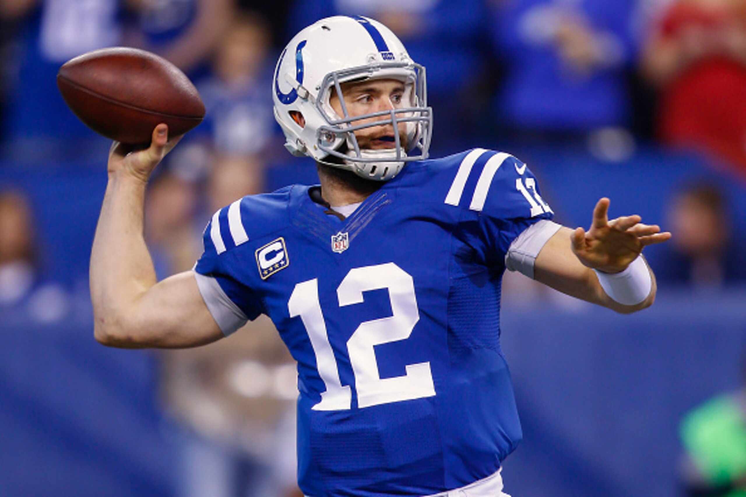 INDIANAPOLIS, IN - DECEMBER  14: Andrew Luck #12 of the Indianapolis Colts drops back to pass during the game against the Houston Texans at Lucas Oil Stadium on December 14, 2014 in Indianapolis, Indiana. (Photo by Michael Hickey/Getty Images)