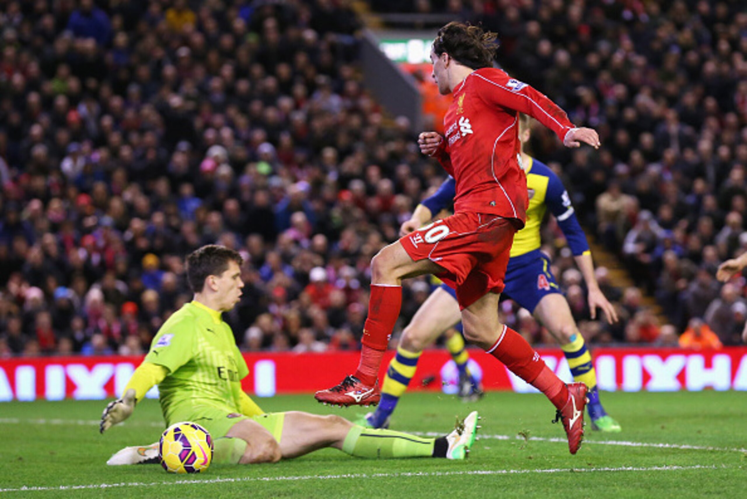 LIVERPOOL, ENGLAND - DECEMBER 21:  Lazar Markovic of Liverpool has his shot saved by Wojciech Szczesny of Arsenal during the Barclays Premier League match between Liverpool and Arsenal at Anfield on December 21, 2014 in Liverpool, England.  (Photo by Alex