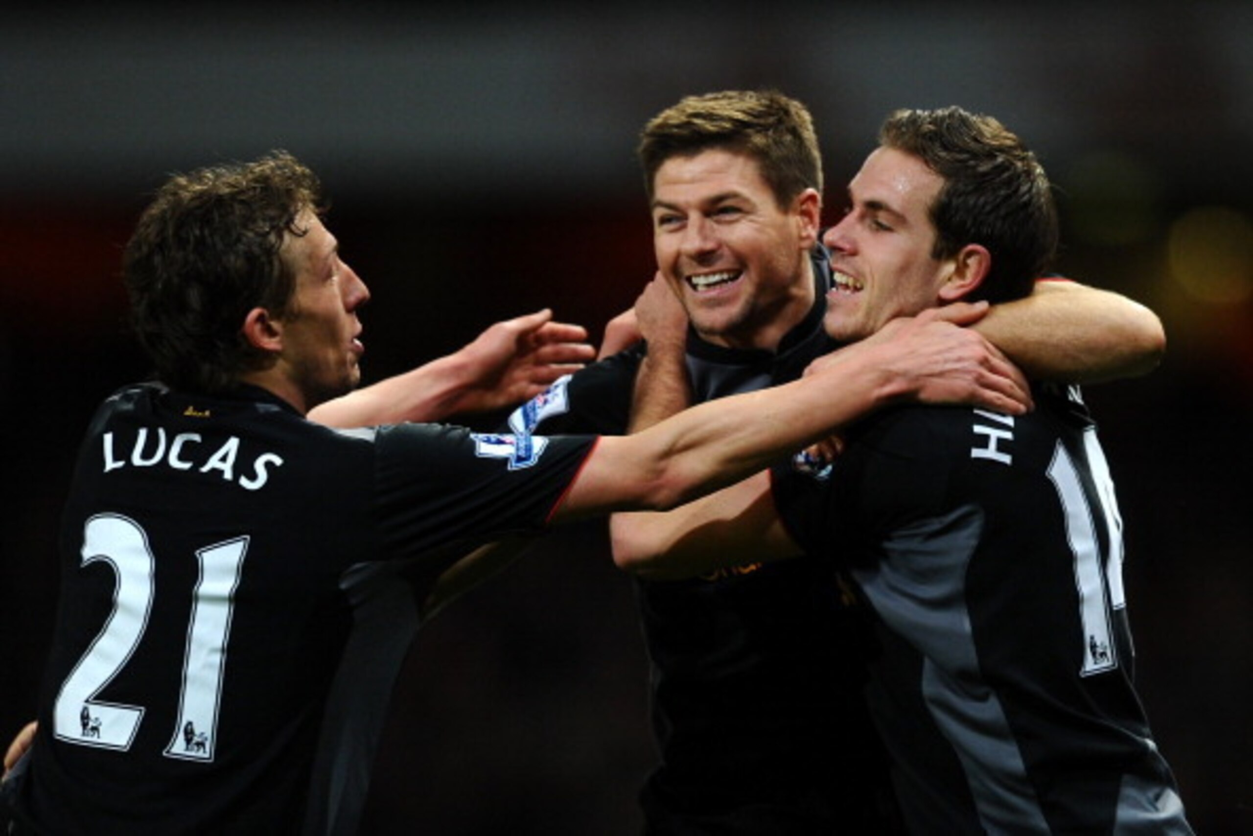 LONDON, ENGLAND - JANUARY 30:  Jordan Henderson of Liverpool celebrates scoring their second goal with lSteven Gerrard and Lucas Leiva of Liverpool during the Barclays Premier League match between Arsenal and Liverpool at Emirates Stadium on January 30, 2