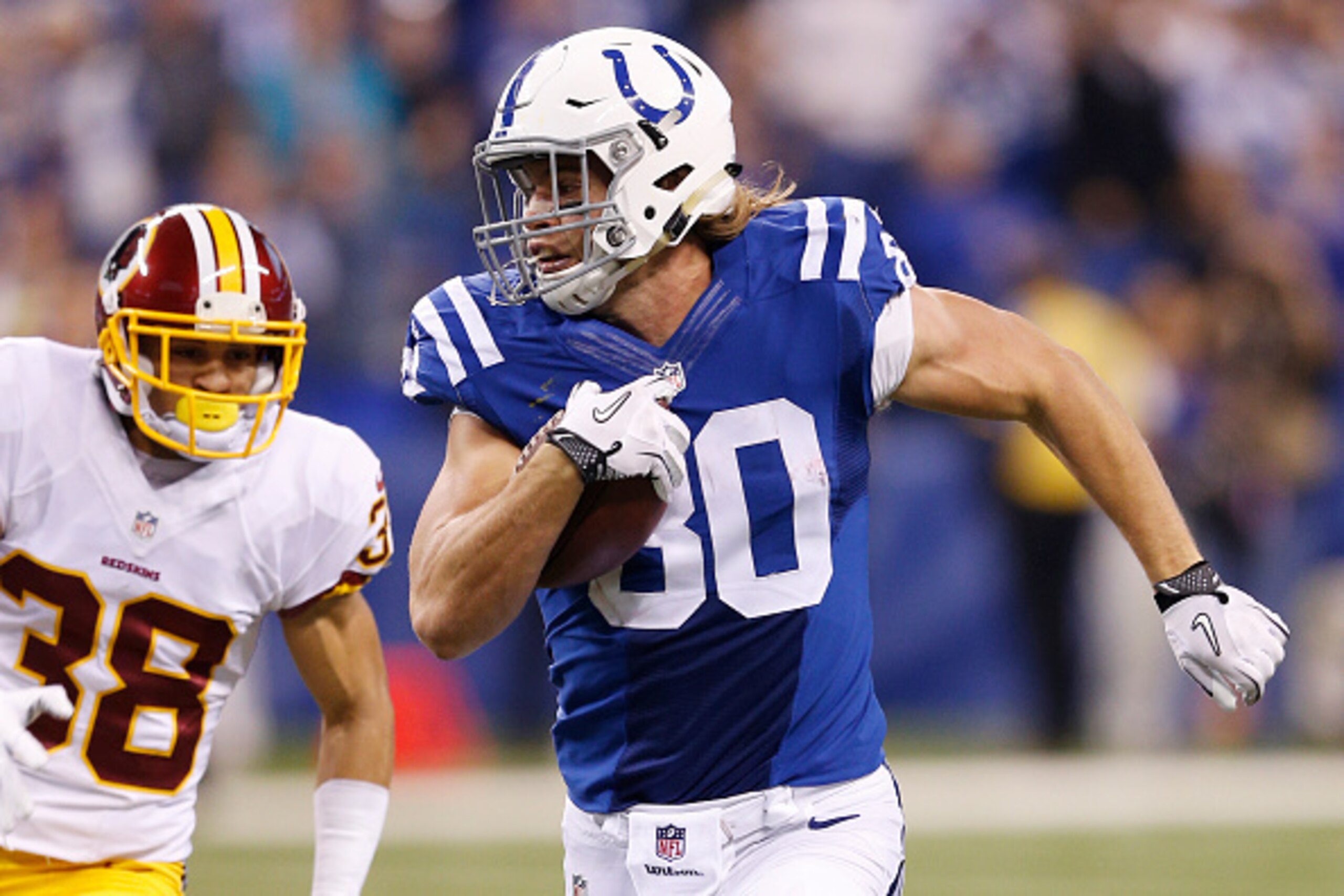 INDIANAPOLIS, IN - NOVEMBER 30: Coby Fleener #80 of the Indianapolis Colts runs downfield on a 73-yard touchdown reception in the second half of the game against the Washington Redskins at Lucas Oil Stadium on November 30, 2014 in Indianapolis, Indiana. T