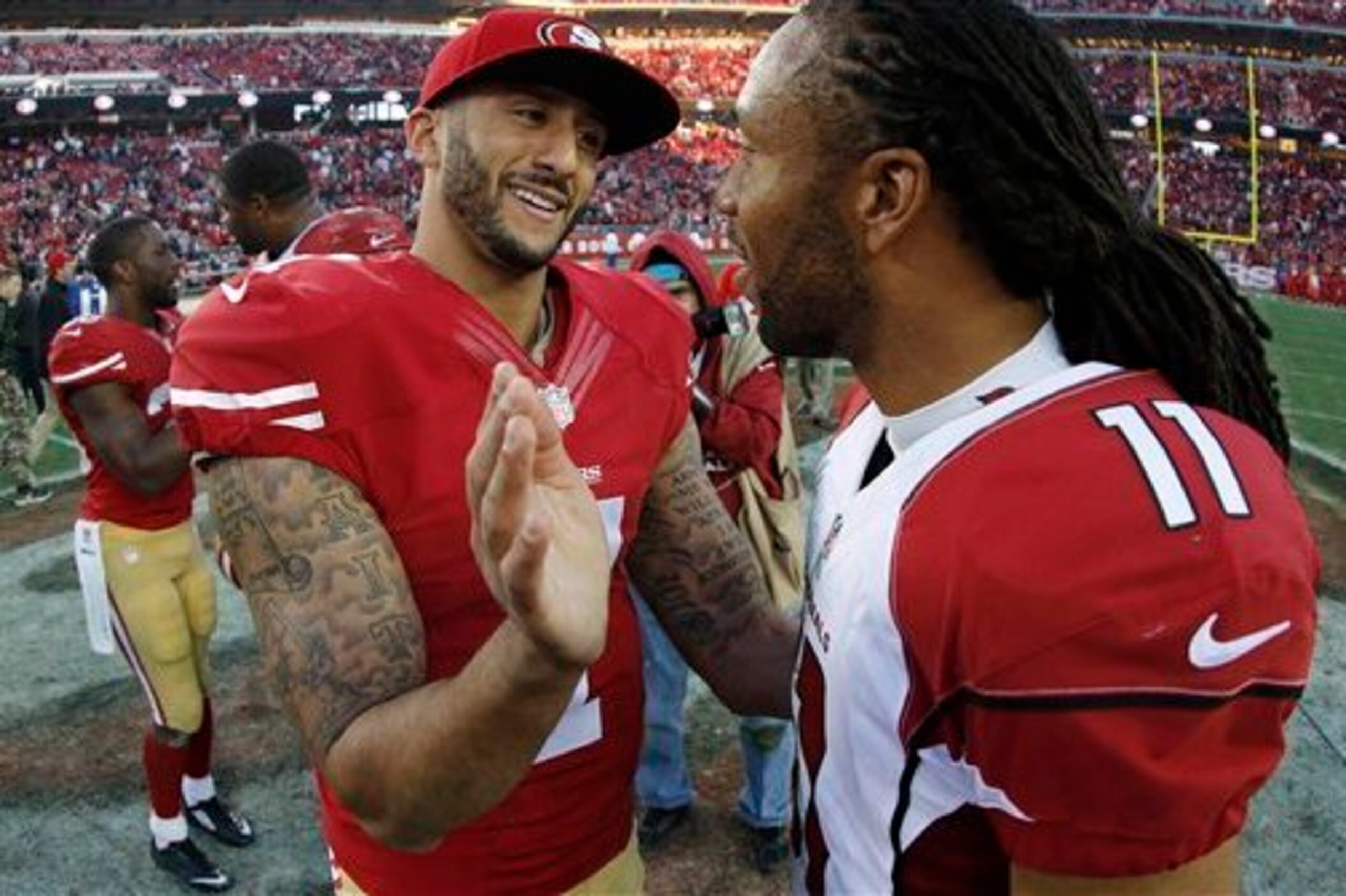 Even with a still developing Colin Kaepernick (left) and without any wide receiver of Larry Fitzgerald's caliber, defensive line is priority No. 1 for the 49ers.